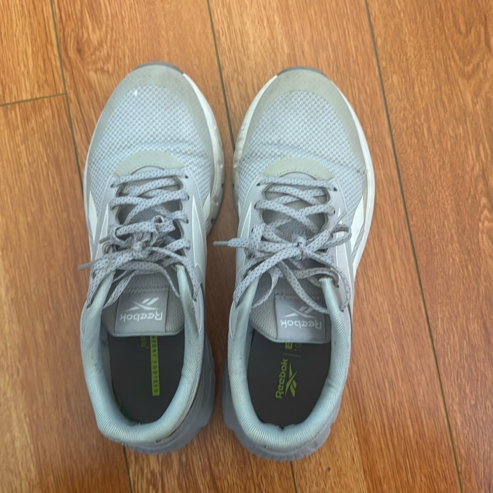 Gray Reebok sneakers